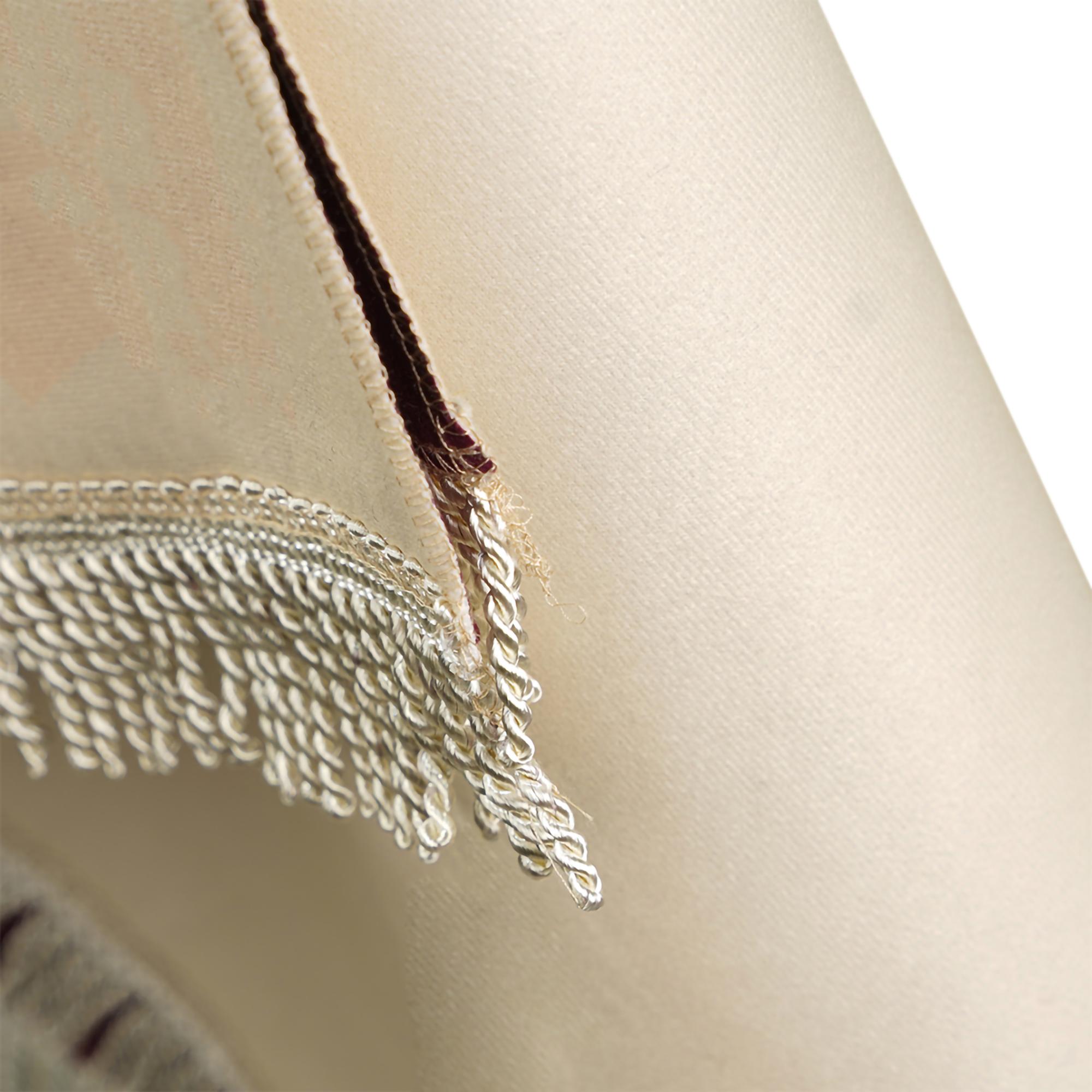 Textured satin-stitch detail on linen